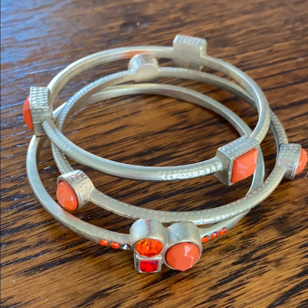 Orange and gold bangles.